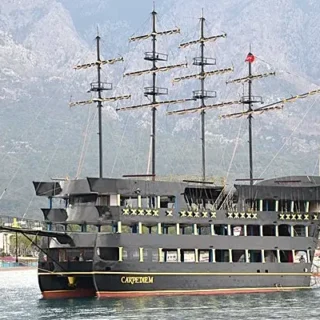 Experience the Red Dragon Pirate Boat Tour in Kemer. Cruise to Phaselis, Paradise, and Moonlight bays for swimming, sunbathing, and unforgettable fun.