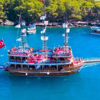 Book your Side Pirate Boat trip! All-Inclusive excursion to Manavgat River. Enjoy swimming, lunch, & fun for the whole family. Great value tour!