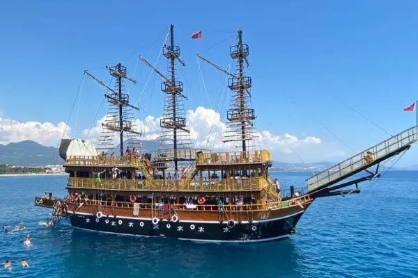 Join the Alanya Pirate Boat Tour! Best sea trip to see Red Tower, caves, and Cleopatra Beach. Includes lunch, foam party, and transfer. Book your fun excursion!